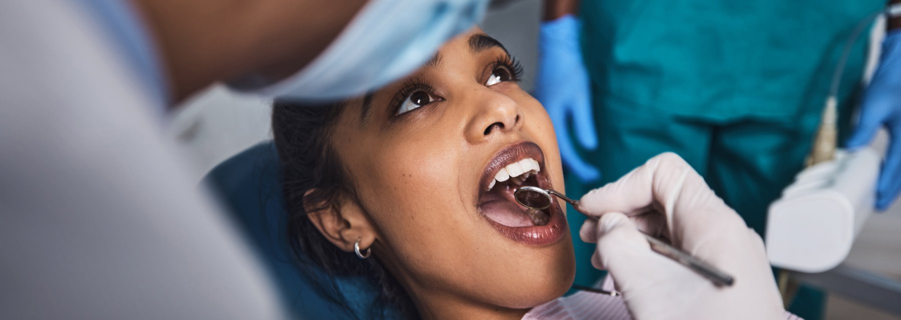 A Woman Being Examined By A Dentist At An Endodontics Practice In Walton Way Ext., Augusta, Georgia