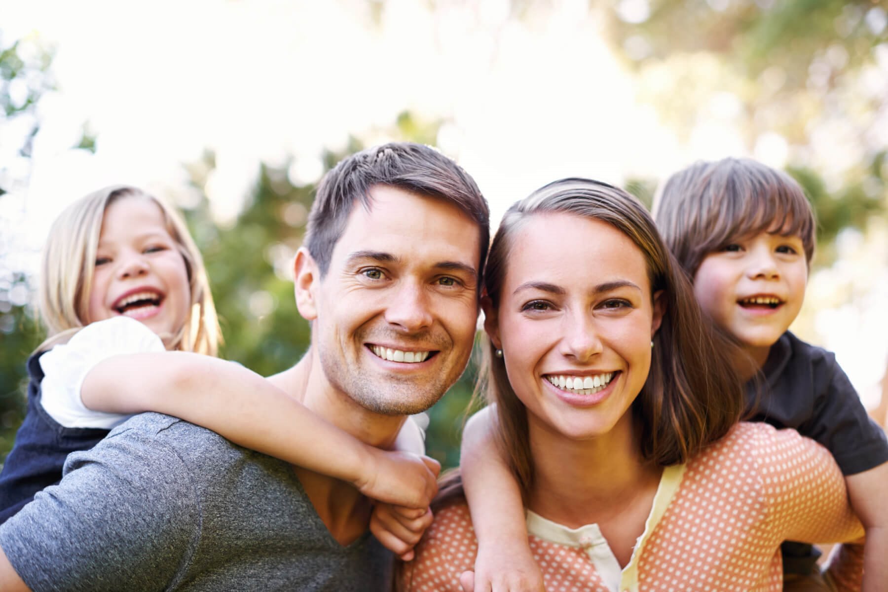A Happy Family Smiles Together At On Walton Way Ext. In Augusta, Georgia